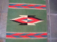 New Mexican vintage textile, a weaving from Chimayo, c. 1940. Closeup photo of center of textile.