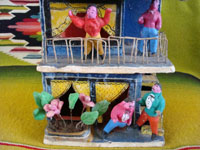 Mexican vintage folk art and Mexican vintage pottery and ceramics, a pottery 2-story apartment filled with Mexican tenants and with pigeons on the roof, by Candelario Medrano, Tlaquepaque, Jalisco, c. 1960. Closeup photo.