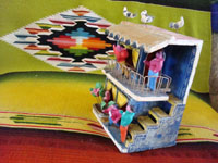 Mexican vintage folk art and Mexican vintage pottery and ceramics, a pottery 2-story apartment filled with Mexican tenants and with pigeons on the roof, by Candelario Medrano, Tlaquepaque, Jalisco, c. 1960. Photo of side of apartment.