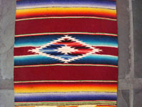 Mexican vintage textile, small Saltillo Sarape, c. 1940. Beautifully woven of fine wool with a silk center-diamond. Photo of the center of the Saltillo Sarape.