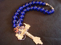 Andean silver cross with blue European trade-bead necklace, both c. 18th century. The cross and necklace of trade-beads were assembled together sometime after the creation of the silver cross in the Andean region (Bolivia, Ecuador, Peru). Main photo of cross and necklace.