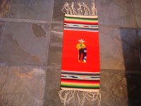Mexican vintage textiles and Saltillo sarapes, a wonderful pair of matching Saltillo sarapes featuring a dashing Mexican charro (horseman) and a lovely China Poblana or charra dancing around a sombrero, c. 1940's. A photo of the Saltillo sarape depicting the brave Charro.