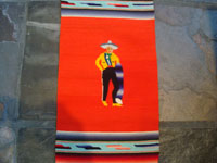Mexican vintage textiles and Saltillo sarapes, a wonderful pair of matching Saltillo sarapes featuring a dashing Mexican charro (horseman) and a lovely China Poblana or charra dancing around a sombrero, c. 1940's. A closeup photo of the charro.