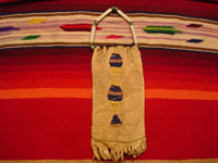 Native American Indian antique beadwork and folk-art, a Lakota (Sioux) beaded ration-pouch, c. 1890-1900. The beadwork on the pouch is very fine, and the pouch has a handle of lovely glass beads. Photo of the back side of the Lakota beaded leather pouch.