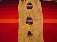 Native American Indian antique beadwork and folk-art, a Lakota (Sioux) beaded ration-pouch, c. 1890-1900. The beadwork on the pouch is very fine, and the pouch has a handle of lovely glass beads. Another photo of the back side of the beaded leather Lakota (Sioux) ration pouch.