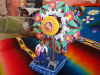 Mexican vintage folk art, and Mexican vintage pottery and ceramics, a lovely and very colorful pottery ferris wheel, filled with delighted people, Ocumicho, Michoacan, c. 1960's. A photo of the people and doggies at the base of the ferris wheel, awaiting a turn to ride.