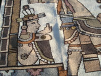 Mexican vintage textiles and sarapes, a beautiful Zapotec textile with natural wool colors and wonderful figures of Mayan warriors and a shaman, Oaxaca, c. 1950's. Closeup photo of a Mayan figure on the textile.