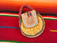 Native American Indian beaded pouch, Apache, c. 1850's. The pouch (probably a "ration pouch") has a wonderful handle and beaded flap. The beads are very small (including the "whities") and the beadwork is exquisite. Main photo of pouch.