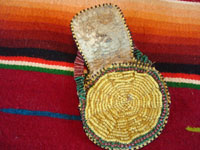 Native American Indian beaded pouch, Apache, c. 1850's. The pouch (probably a "ration pouch") has a wonderful handle and beaded flap. The beads are very small (including the "whities") and the beadwork is exquisite. Photo shows inside of pouch with flap raised.