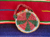 Native American Indian beaded pouch, Apache, c. 1850's. The pouch (probably a "ration pouch") has a wonderful handle and beaded flap. The beads are very small (including the "whities") and the beadwork is exquisite. Photo of the back side of pouch.