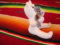 Native American Indian vintage pottery, a storyteller in the form of a bear mother with cub, Cochiti, c. 1980. The bears are beautifully formed and painted. Photo showing a side view.