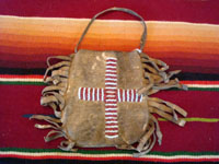 Native American Indian antique beadwork and folk art, a very finely beaded bag with some metallic beads, Plains, c. 1890-1900. The bag has a lovely checker-board pattern on one side, and a cross on the other. Photo of the back side of pouch.