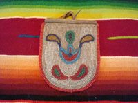 Native American Indian antique beadwork and folk art, a finely beaded belt-pouch, Cree, c. 1910-20. The beadwork is very fine and coloful, and condition is excellent given the age of the piece.