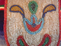 Native American Indian antique beadwork and folk art, a finely beaded belt-pouch, Cree, c. 1910-20. The beadwork is very fine and coloful, and condition is excellent given the age of the piece. Closeup photo of the fine beadwork.