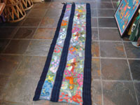 Mexican vintage textiles and sarapes, a beautifully woven and embroidered woman's skirt, Guerrero, 1940's. The long skirt, made to be wound around the waist and secured with a belt, is embroidered with wonderful animals, plants, and figures. Main photo of skirt.