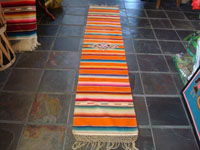 Mexican vintage textiles and sarapes, a lovely Saltillo sarape runner with a wonderful center design, c. 1940. Very beautifully woven of fine wool with silk in the center medallion and decorative side-bars. Main photo of runner.