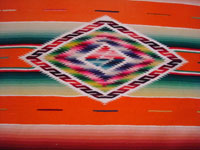 Mexican vintage textiles and sarapes, a lovely Saltillo sarape runner with a wonderful center design, c. 1940. Very beautifully woven of fine wool with silk in the center medallion and decorative side-bars. Closeup photo of the center medallion.