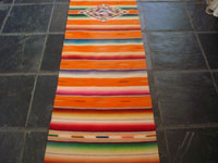 Mexican vintage textiles and sarapes, a lovely Saltillo sarape runner with a wonderful center design, c. 1940. Very beautifully woven of fine wool with silk in the center medallion and decorative side-bars. Another photo of the saltillo sarape.