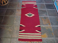 New Mexican vintage textile, a weaving from Chimayo, New Mexico, c. 1930's. The textile has a very deep burgundy background, and the colors are bright and very beautiful.  Main photo.