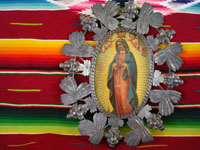 Mexican vintage tinwork art, a lovely tin-art frame with a very beautiful image of Our Lady of Guadalupe. The tinwork frame dates from c. 1930's. Main photo of the tin frame with the image of Our Lady of Guadalupe.