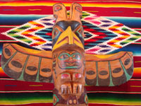 Native American Indian antique folk art, a wood-carved totem pole from the Pacific Northwest, Squamish, c. 1950. The totem pole features a wonderful eagle at the top, a transformation figure, and a beautiful bear. Photo of the top eagle.