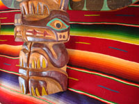 Native American Indian antique folk art, a wood-carved totem pole from the Pacific Northwest, Squamish, c. 1950. The totem pole features a wonderful eagle at the top, a transformation figure, and a beautiful bear. Another closeup of the bear.