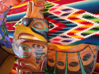 Native American Indian antique folk art, a wood-carved totem pole from the Pacific Northwest, Squamish, c. 1950. The totem pole features a wonderful eagle at the top, a transformation figure, and a beautiful bear. Another closeup photo of the eagle at the top of the pole.