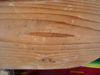 Native American Indian antique folk art, a wood-carved totem pole from the Pacific Northwest, Squamish, c. 1950. The totem pole features a wonderful eagle at the top, a transformation figure, and a beautiful bear. Closeup of the artist's signature on the back of the pole.
