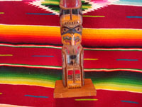 Native American Indian woodcarving and folk art, a lovely totem pole from the Pacific Northwest, c. 1940. The pole is carved from cedar and depicts an eagle and bear. Photo showing the figure near the bottom of the pole.
