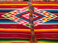 Native American Indian woodcarving and folk art, a lovely totem pole from the Pacific Northwest, c. 1940. The pole is carved from cedar and depicts an eagle and bear. Photo showing a side-view of the totem pole.