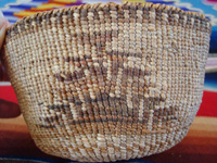 Native American Indian basket, a Klamath twined basket with the porcupine design on the sides, Klamath Indians of Northern California, c. 1910-20. Closeup photo of the design on one side of the Klamath Indian basket.