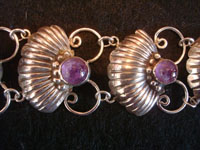 Mexican vintage sterling silver jewelry, and Taxco vintage silver jewelry, a beautiful sterling silver bracelet with lovely amethyst half-spheres, Taxco, c. 1940's. Closeup photo of a part of the Taxco silver jewelry bracelet.