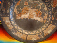 Mexican vintage pottery and ceramics, a very large charger with beautiful and graceful artwork, signed Almado Galvan, Tonala or San Pedro Tlaquepaque, c. 1940's. Another closeup photo of the front of the charger.