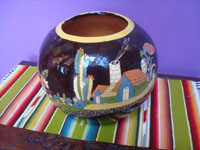 Mexican vintage pottery and ceramics, a lovely blackware Tlaquepaque pottery tecomate with fabulous artwork, Tonala or San Pedro Tlaquepaque, Jalisco, c. 1930's. Photo showing the rural house amidst cacti and plants.