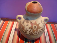 Mexican vintage pottery and ceramics, and Mexican vintage folk art, a wonderful pottery effigy jar with lovely floral and zoomorphic decorations, very likey from the village of Toliman or Amalyatepec, Guerrero, c. 1940's. Photo of the back side of the jar.