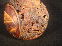 Mexican vintage folk art, a finely carved coconut with scenes from the Mexican Revolution of 1910, c. 1925-35. The carved coconut has the Mexican national emblem of the eagle and snake inlaid in abalone. Photo of one of the horses on the carved coconut.