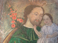 Mexican vintage devotional art, a retablo of Saint Joseph with the child Jesus painted on tin, c. 1870-1900. The colors are vibrant and the artwork is exceptional! Another closeup photo.