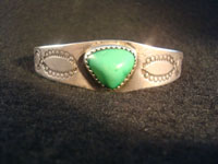 Native American Indian vintage silver jewelry, a Navajo silver bracelet with ingot silver and a beautiful turquoise stone, c. 1920.  Main photo.