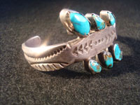 Native American Indian vintage silver jewelry, a Navajo sterling silver bracelet with 6 beautiful turquoise stones, c. 1920. Made from ingot silver, with wonderful early stamping and file marks. This is a treasure for the collector of Native American Indian jewelry! Photo of second side of Navajo ingot silver bracelet.