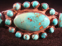 Native American Indian vintage silver jewelry, a Navajo sterling silver bracelet with wonderful natural turquoise stones, c. 1920; ingot silver. The turquoise is about the most beautiful you will ever see!  Closeup photo of front of Navajo ingot silver bracelet.