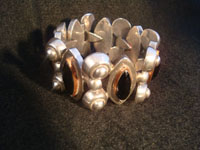 Mexican vintage silver jewelry, a Taxco vintage sterling silver bracelet c. 1940. The bracelet is 980 sterling with beautiful black onyx stones set with copper bezzles. Main photo of Taxco bracelet.