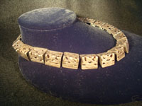 Mexican vintage silver jewelry, a lovely Taxco sterling silver necklace, c . 1940. The necklace is composed of silver carved and hollowed out trianglular pieces and is exquisite! A photo showing a side-view of the Taxco silver necklace.
