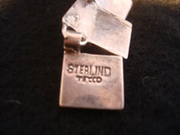 Mexican vintage silver jewelry, a lovely Taxco sterling silver necklace, c . 1940. The necklace is composed of silver carved and hollowed out trianglular pieces and is exquisite! A photo showing the mark or signature on the back of the Taxco silver necklace.