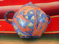 Mexican vintage pottery and ceramics, creamer and suger set by famed artist Balbino Lucano, c. 1920-30. This is one of the finest examples of Balbino's work that we have ever seen. Beautifully decorated with palm trees and animals chasing each other around the pieces! Signed on bottom of sugar, "B D Lucano".
