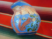 Mexican vintage pottery and ceramics, creamer and suger set by famed artist Balbino Lucano, c. 1920-30. This is one of the finest examples of Balbino's work that we have ever seen. Beautifully decorated with palm trees and animals chasing each other around the pieces! Signed on bottom of sugar, "B D Lucano". Photo of sugar.