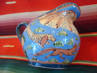 Mexican vintage pottery and ceramics, creamer and suger set by famed artist Balbino Lucano, c. 1920-30. This is one of the finest examples of Balbino's work that we have ever seen. Beautifully decorated with palm trees and animals chasing each other around the pieces! Signed on bottom of sugar, "B D Lucano". Another photo of sugar.