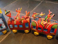 Mexican vintage folk art, and Mexican vintage pottery and ceramics, a pottery train with colorful Mexican passengers, attributed to the very famous folk artist, Candelario Medrano, Santa Cruz de las Huertas, Jalisco, c. 1960. This is a wonderful piece of folk art and an excellent example of Medrano's work!