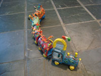 Mexican vintage folk art, and Mexican vintage pottery and ceramics, a pottery train with colorful Mexican passengers, attributed to the very famous folk artist, Candelario Medrano, Santa Cruz de las Huertas, Jalisco, c. 1960. This is a wonderful piece of folk art and an excellent example of Medrano's work! Main photo.