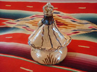 Mexican pottery and ceramics, a pottery figure of Our Lady of Good Health from Tzintzuntzan, Michoacan, c. 2010. Photo of back of virgin.