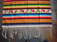 Mexican vintage textiles and sarapes, a lovely Saltillo sarape with a wonderful center diamond of silk, c. 1920's. The predominant color is a lovely golden tan, with very colorful intermittant bands. Another photo of side-bar and fringe.